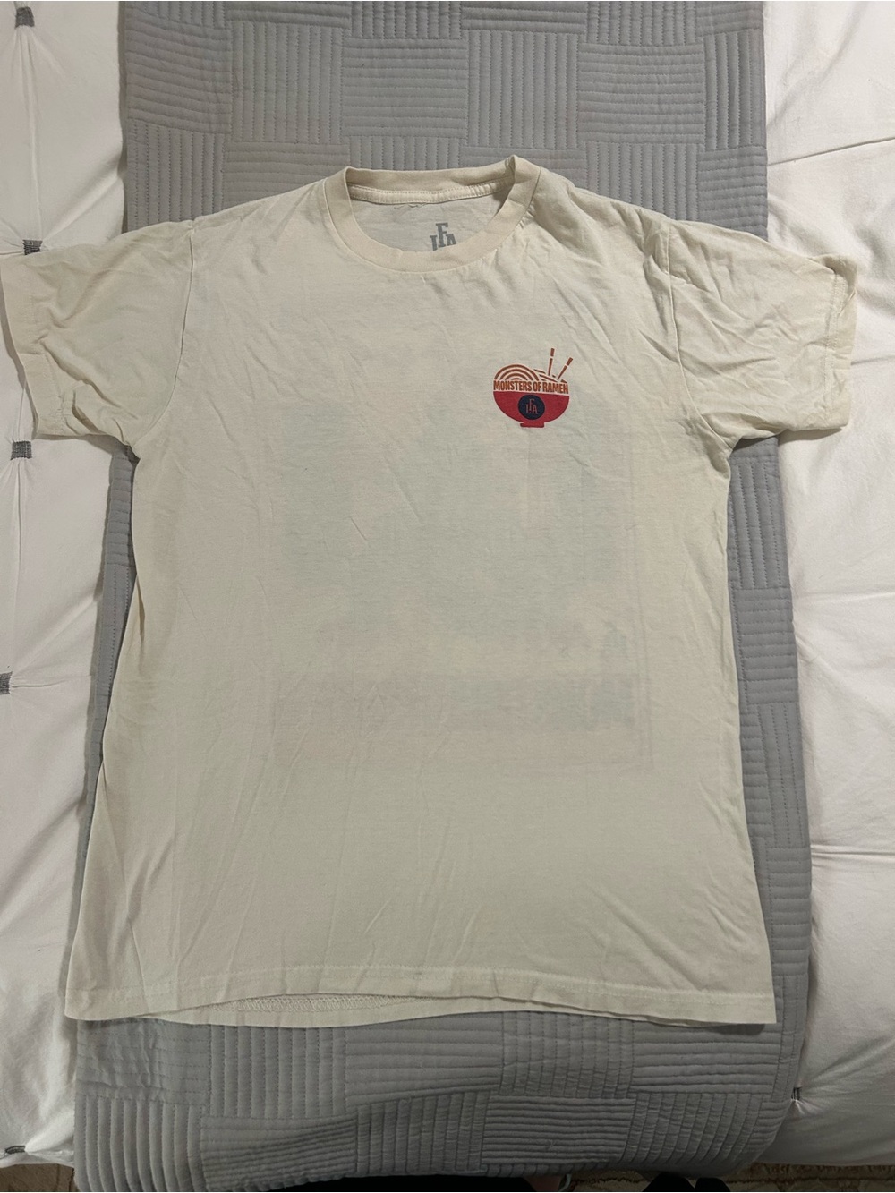 Men’s Cream Short Sleeve Tee with Small Red and Orange Chest Graphic